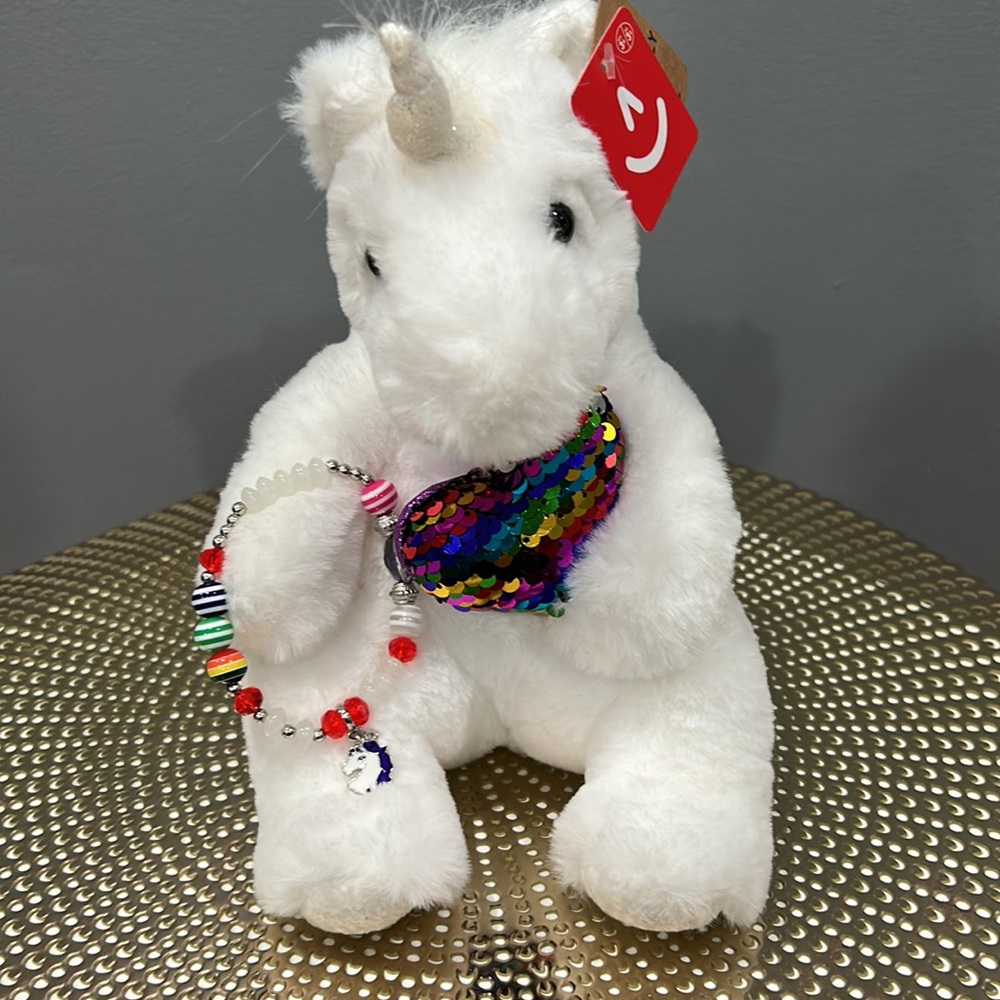 Aurora unicorn plush. Includes the unicorn bracelet. Great for a gift. 🦄
